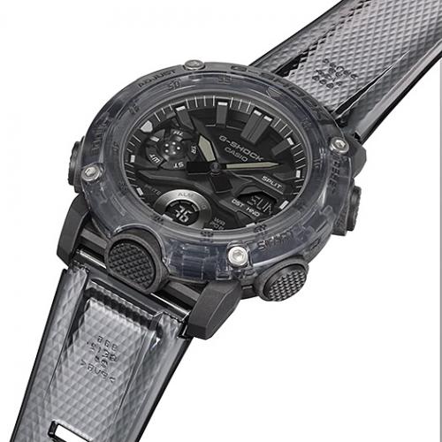 Рифленая кнопка LED-подсветки вынесена на переднюю панель корпуса часов CASIO G-SHOCK GA-2000SKE-8AER Скелетон.